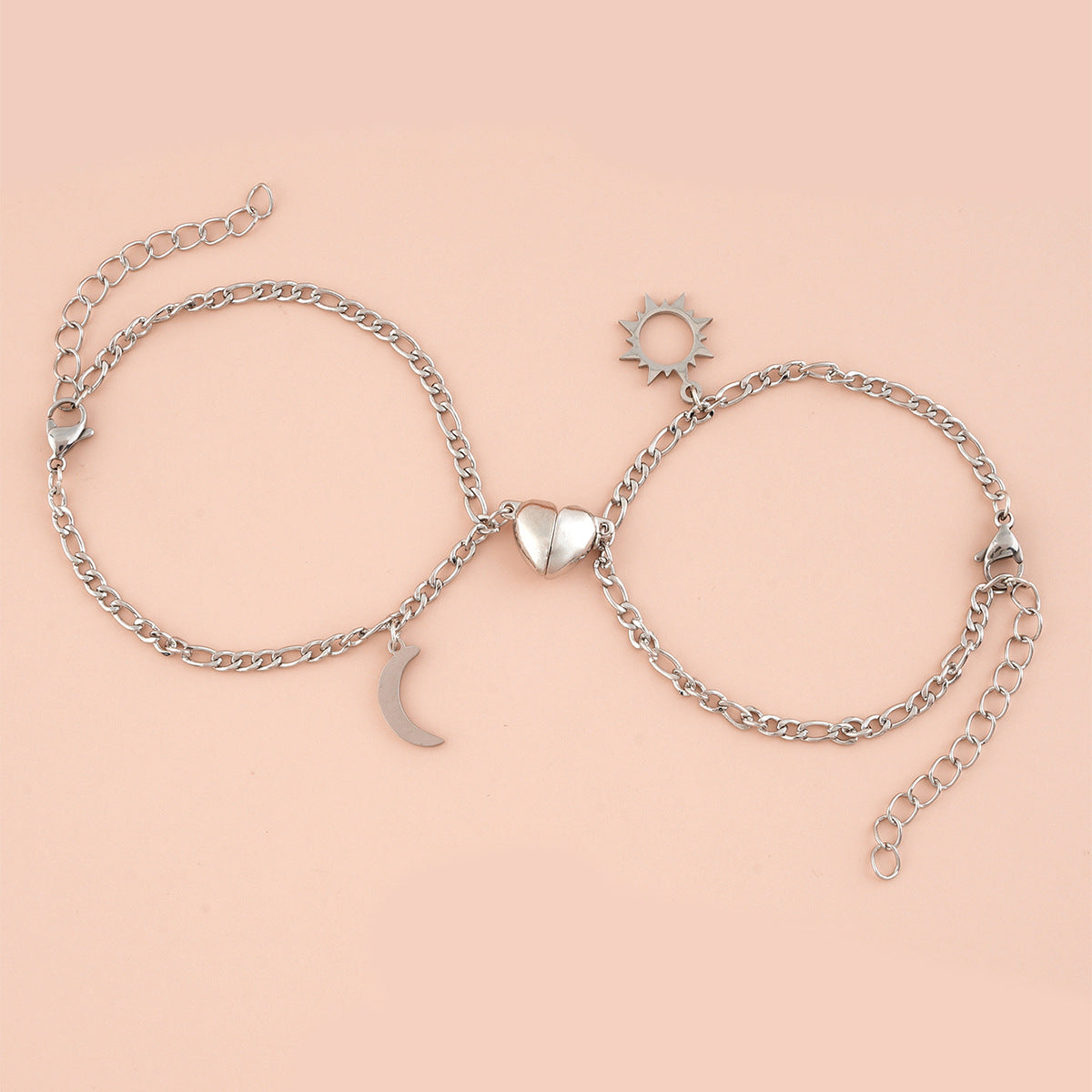 Coppia Bracciali in acciaio con ciondolo (mezzo cuore magnetico)